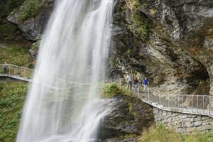 Walk behind the Steinsdalsfossen waterfall - The great waterfall and fjord tour, Hardangerfjord, Norway